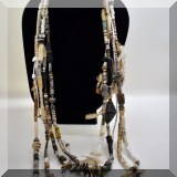J119. Beaded multi-strand necklace with sterling bear charm. - $60 